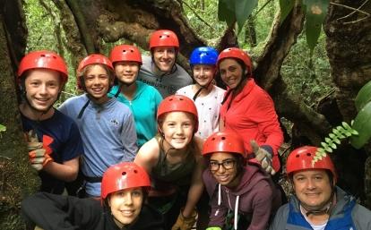Middle school students take a group photo before they go zip lining in Costa Rica Projects Abroad volunteer prepare for their ziplining experience through the Costa Rican forest